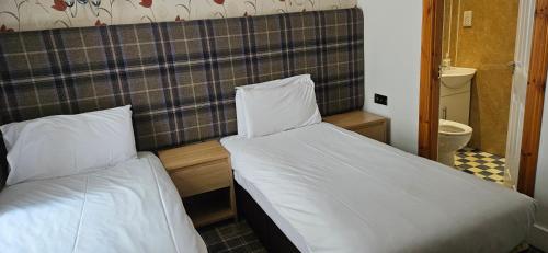 Letto o letti in una camera di Armadale Guest House