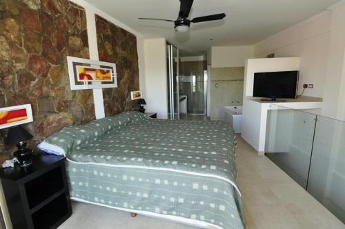 Ένα ή περισσότερα κρεβάτια σε δωμάτιο στο Apart Hotel Mallak