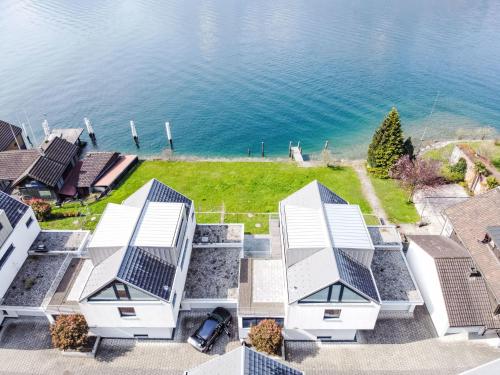 an aerial view of a house with solar panels at Holiday Home Villa am See 3 by Interhome in Sisikon