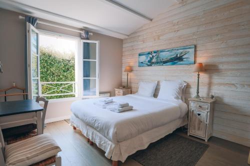 Ένα ή περισσότερα κρεβάτια σε δωμάτιο στο Villa des Terroirs