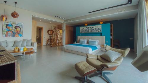 a large bedroom with a bed and a couch at Bavaro Beach Dakhla in Dakhla