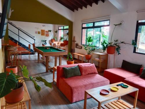 a living room with a ping pong table at La Seventy Nomad Mood in Medellín
