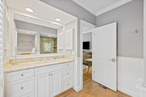 a bathroom with a sink and a mirror at 4976 Turtle Point in Kiawah Island
