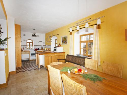 a kitchen and dining room with a table and chairs at Villa Rosencottage by Interhome in Heyda