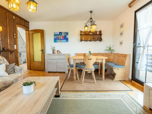 a living room with a table and a couch at Apartment Wichtelmännchen by Interhome in Dittishausen