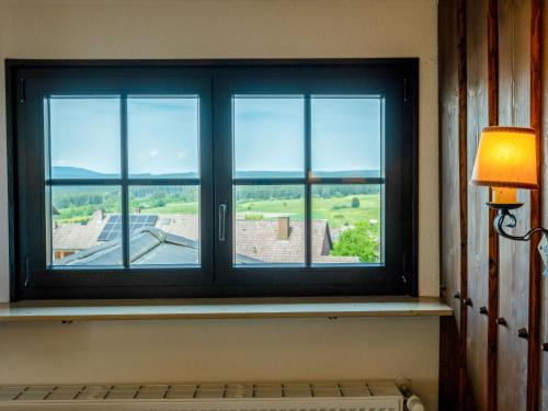 a window in a room with a view of a building at Apartment Wichtelmännchen by Interhome in Dittishausen