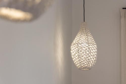 a chandelier hanging from a wall in a room at Pergola in Pollonia
