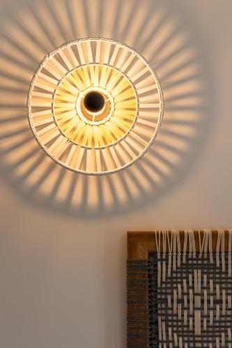 a light fixture hanging from a ceiling at Pergola in Pollonia