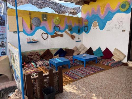 a living room with a couch and a table at Dahab Days Hostel in Dahab