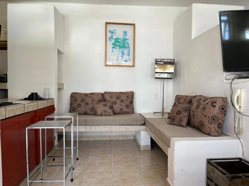 Televisyen dan/atau pusat hiburan di INMOTEGA - Suites TG