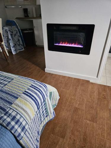 a living room with a fire place in a wall at White Cap Village Unit 6 in Old Orchard Beach