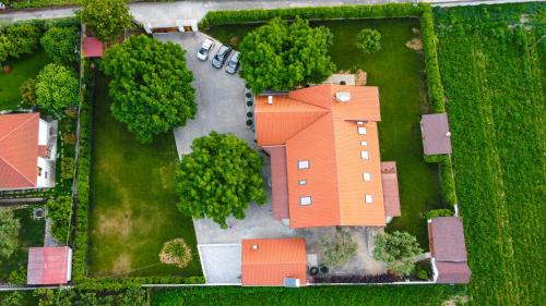 an overhead view of a house with orange roof at Countryside luxury studios in Káto Lekhónia