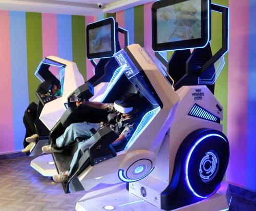 two people laying on a video game console at Lagoona Beach Luxury Resort and Spa in Manama