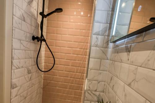 a shower with a shower head in a bathroom at 9 Bedroom all Ensuite- Exclusive Use in Auchterarder