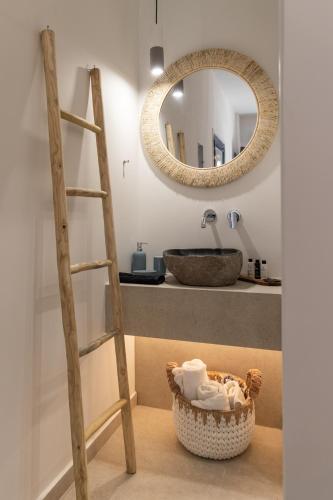 a bathroom with a ladder and a sink and a mirror at Pergola in Pollonia