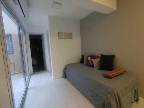 a small bedroom with a bed and a window at Nueva Cordoba Funcional in Cordoba