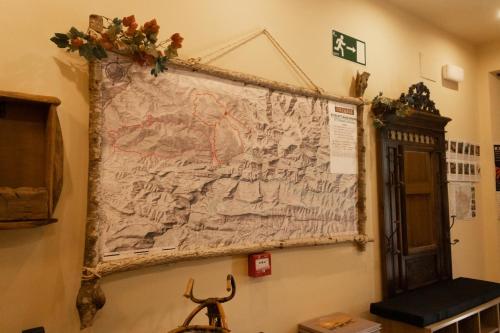 a map hanging on the wall of a room at Hostal Rural Iratiko Urkixokoa in Orbaiceta