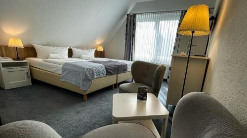 Postel nebo postele na pokoji v ubytování Hotel & Restaurant Seebrücke