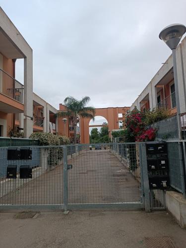 a gate in front of a building at RESIDENCE TERRAE Intero appartamento 2 CAMERE MATRIMONIALI in San Ligorio