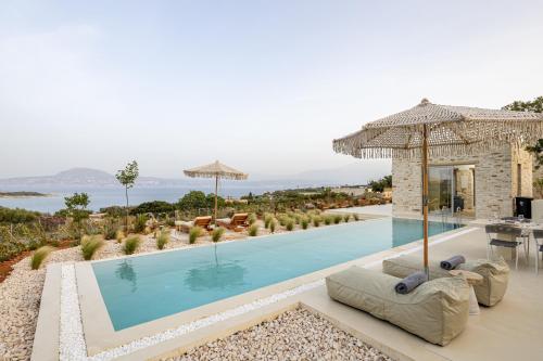 a large swimming pool in a villa at FENNEL Villas in Marathi