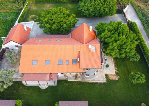 an overhead view of a house with an orange roof at Countryside luxury studios in Káto Lekhónia