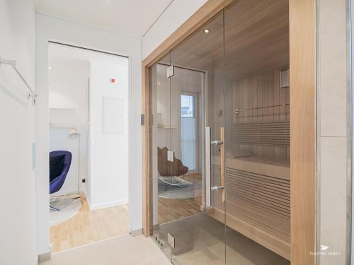 a glass walk in closet in a room at Hausboot Floating Homes - A-Type Laboe FH-LA-03 Baltic Bay in Laboe