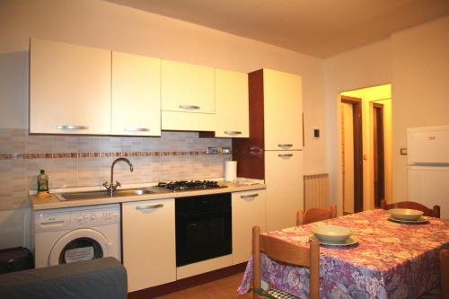 A cozinha ou kitchenette de Apartment delle Brache