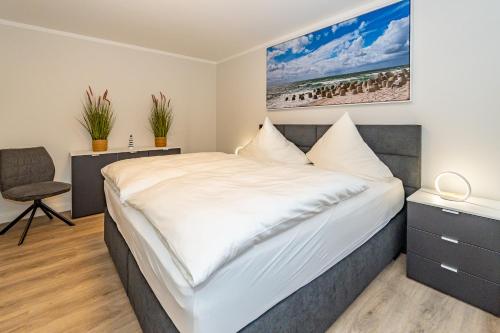 Una cama o camas en una habitación de Haus Strandoase 2
