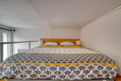 Postel nebo postele na pokoji v ubytování La ToulouZEN Hyper-Centre