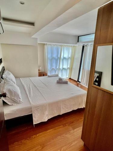 Katil atau katil-katil dalam bilik di Spacious and Cozy 2-BR in City