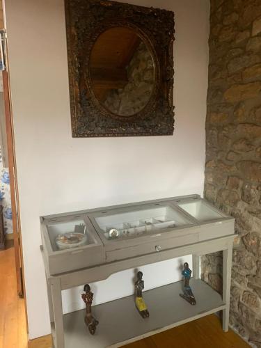 a table with two toy figurines on top of it at La Casina de Lucia in Merodio
