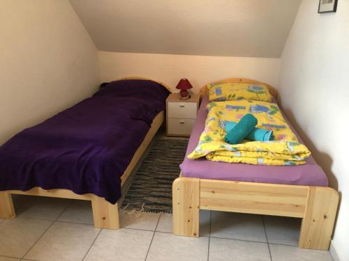Postel nebo postele na pokoji v ubytování Napfény Ház Sonnenschein Haus