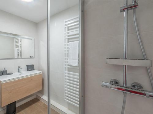 a bathroom with a sink and a shower at Appartement 2 pièces - Centre Vieil Alpe, parking inclus - FR-1-645-59 in LʼHuez