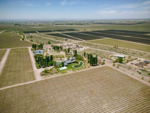 an aerial view of a farm in a field at La Morada Lodge in Vista Flores
