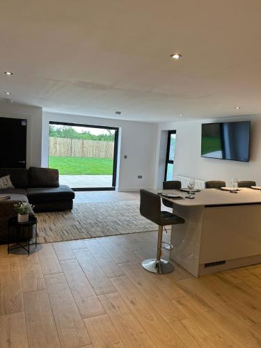 a living room with a couch and a table at Cosy nook in Hardwick
