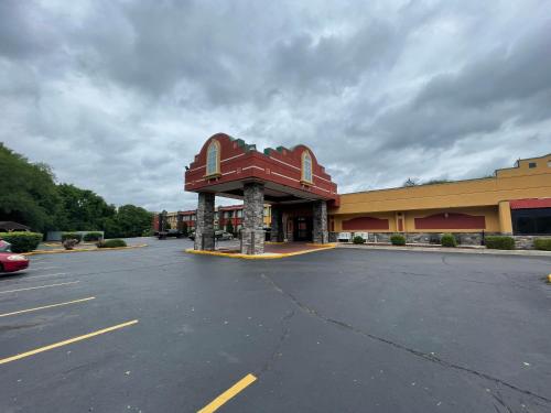 an empty parking lot in front of a store at Quality Inn Conference Center Logansport in Logansport