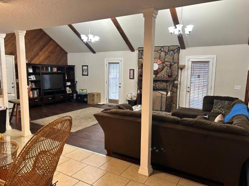 a living room with a couch and a tv at Quite and Beautiful Stay in Montgomery
