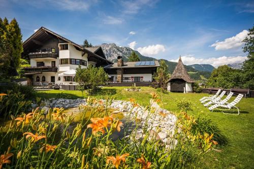 a house in the mountains with a garden at Landhaus St. Georg in Gröbming