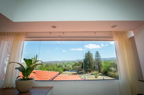 a window with a view of a roof at La Santa Hotel Boutique in Mendiolaza