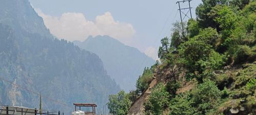 a view of a mountain with mountains in the background at Hotel Fateh Heights in Pāndukeshwar