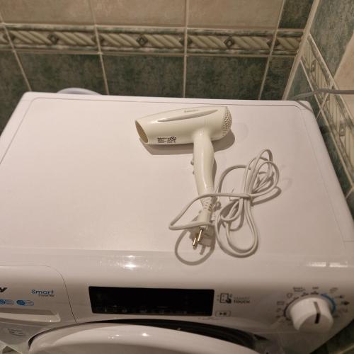 a phone on top of a toilet in a bathroom at Apartament Sybiraków in Białystok
