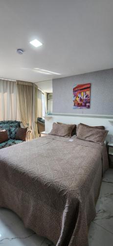 a bedroom with a large bed in a room at Antonio's Hotel e Spa - Airport in Brasilia