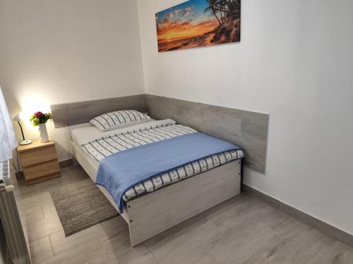 Postel nebo postele na pokoji v ubytování Apartman Nino
