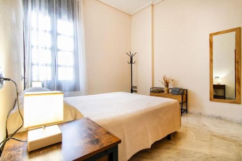 En eller flere senge i et værelse på Mercantil - Apartments