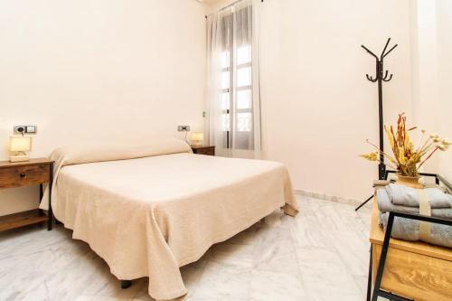 En eller flere senge i et værelse på Mercantil - Apartments