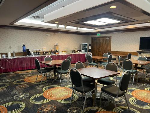 a conference room with tables and chairs and a podium at Quality Inn Conference Center Logansport in Logansport