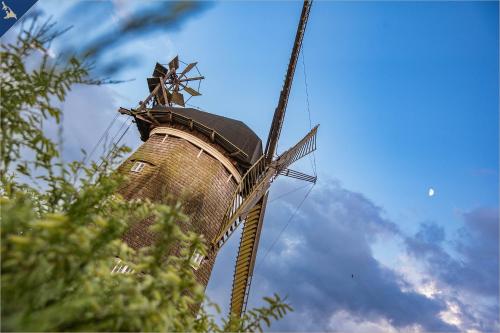 a windmill with a cross on the top of it at Kimpi 3 in Ostseebad Koserow