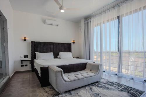 Postel nebo postele na pokoji v ubytování Instyle Residences at RIZZ SUITES