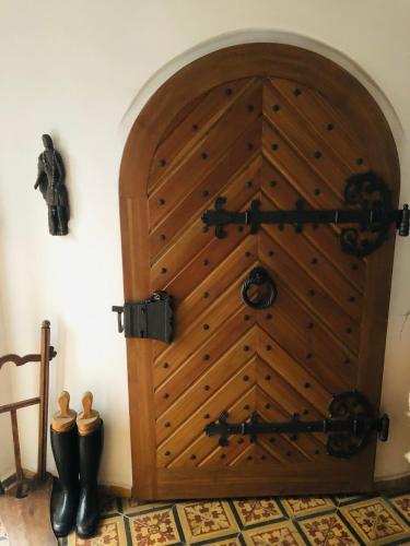 a large wooden door in the corner of a room at Rotunda U Václava in Šebkovice