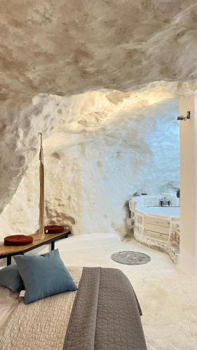 a bedroom with a wall mural of a bath tub at Cave house in Heraklio Town
